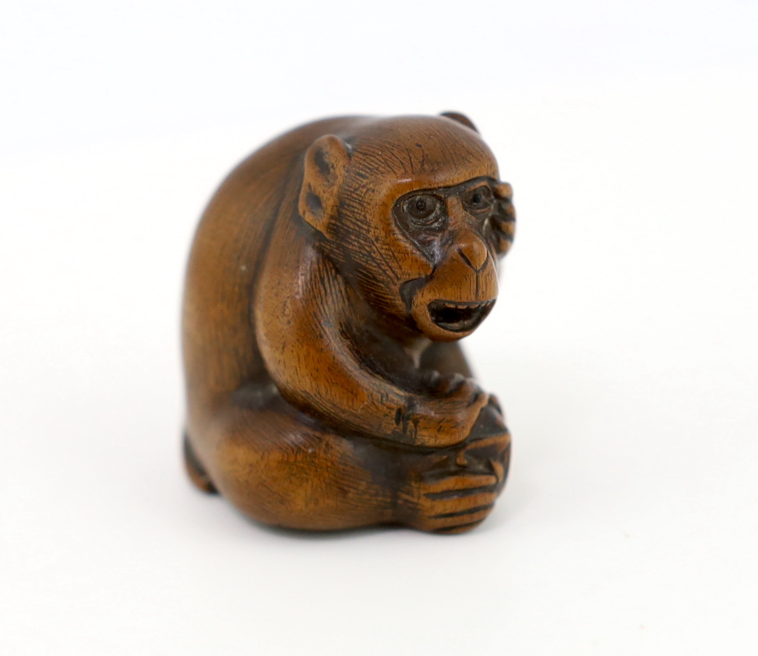 A Japanese carved wood netsuke of an ape, Tamba School, 19th century